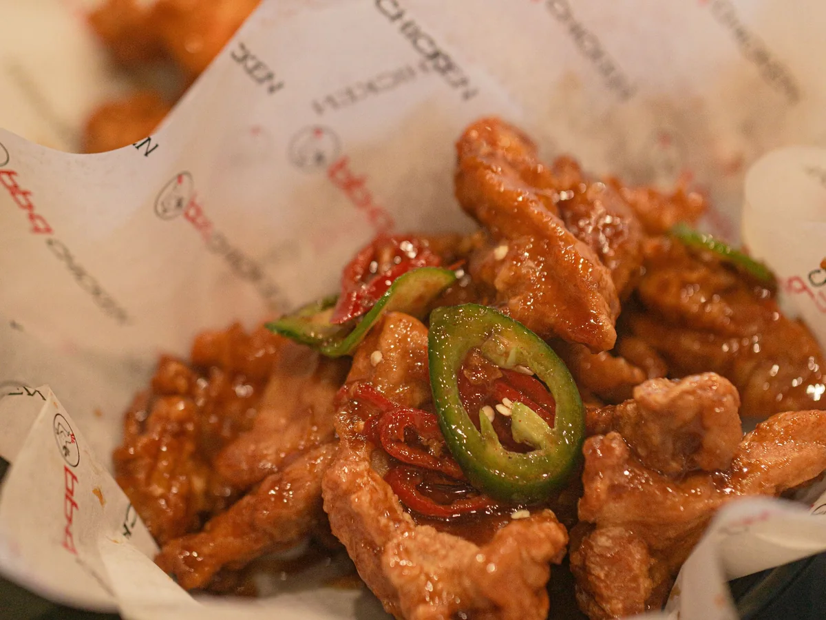 A basket of Korean fried chicken, the chi in chimaek, the ballpark snack paired with cold beer